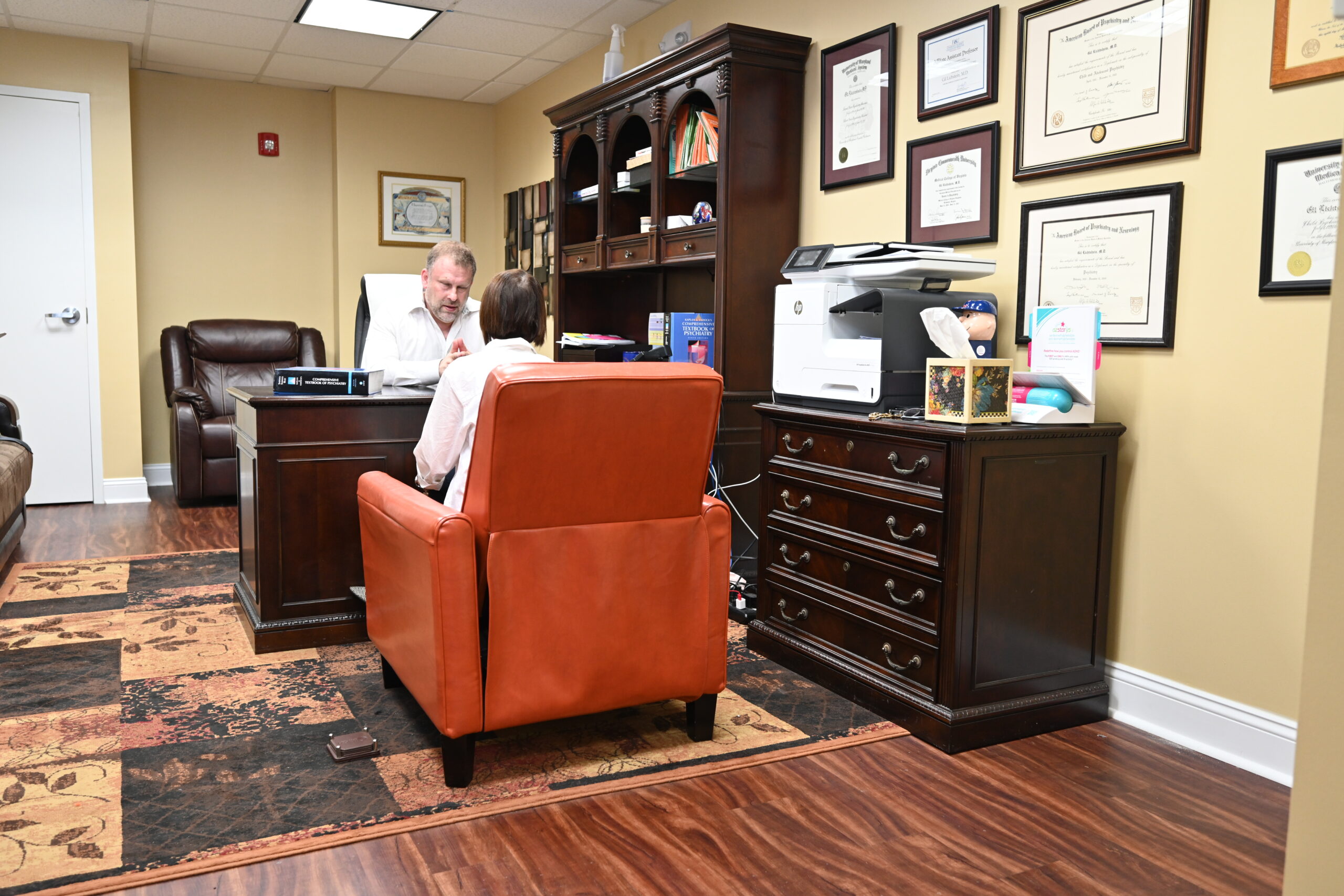 Dr. Gil with patient with full view of Boca office